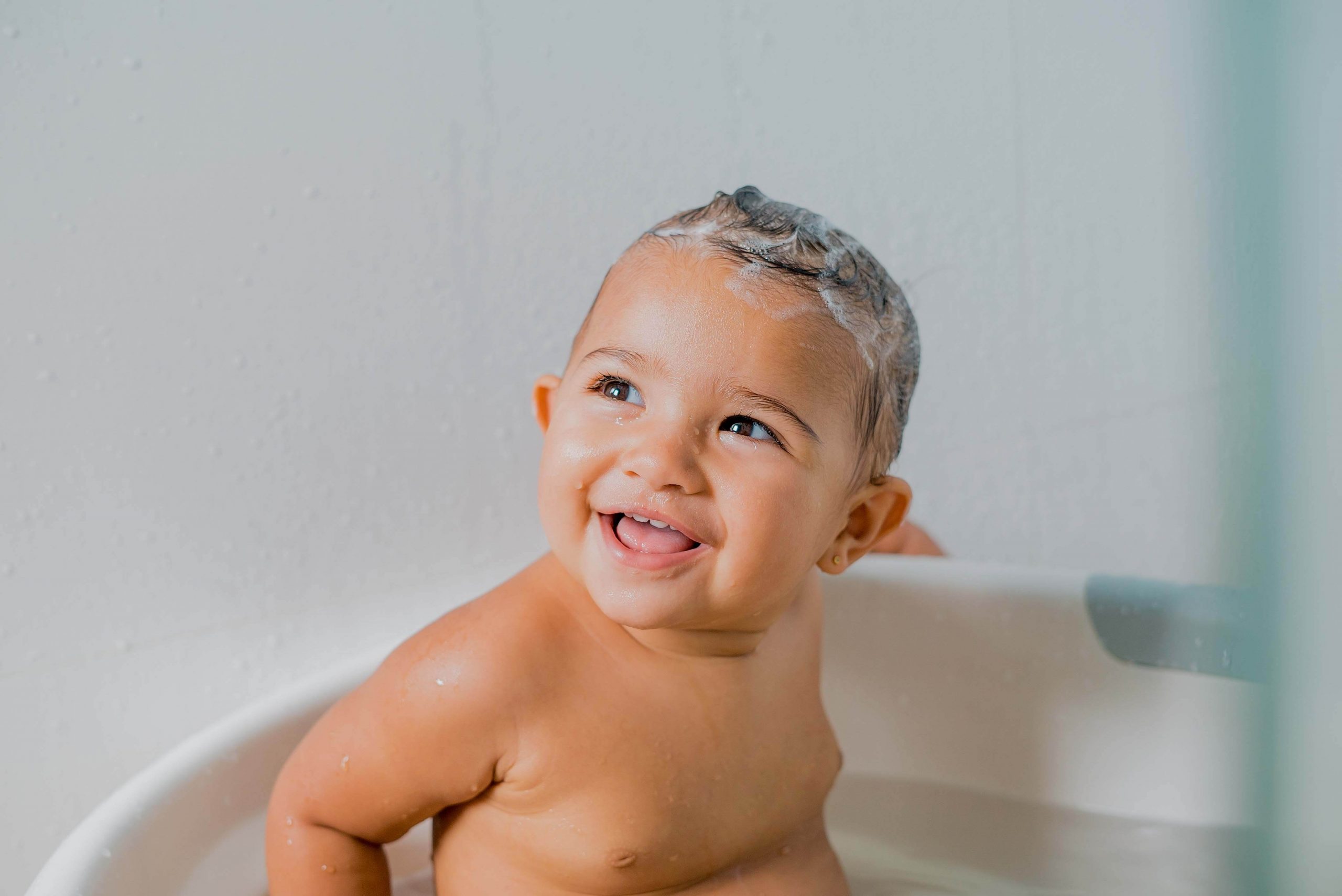 family films and photos: 1 year girl taking shower and smiling