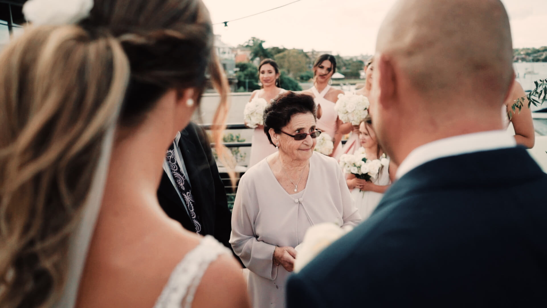 grandma bringing the wedding rings